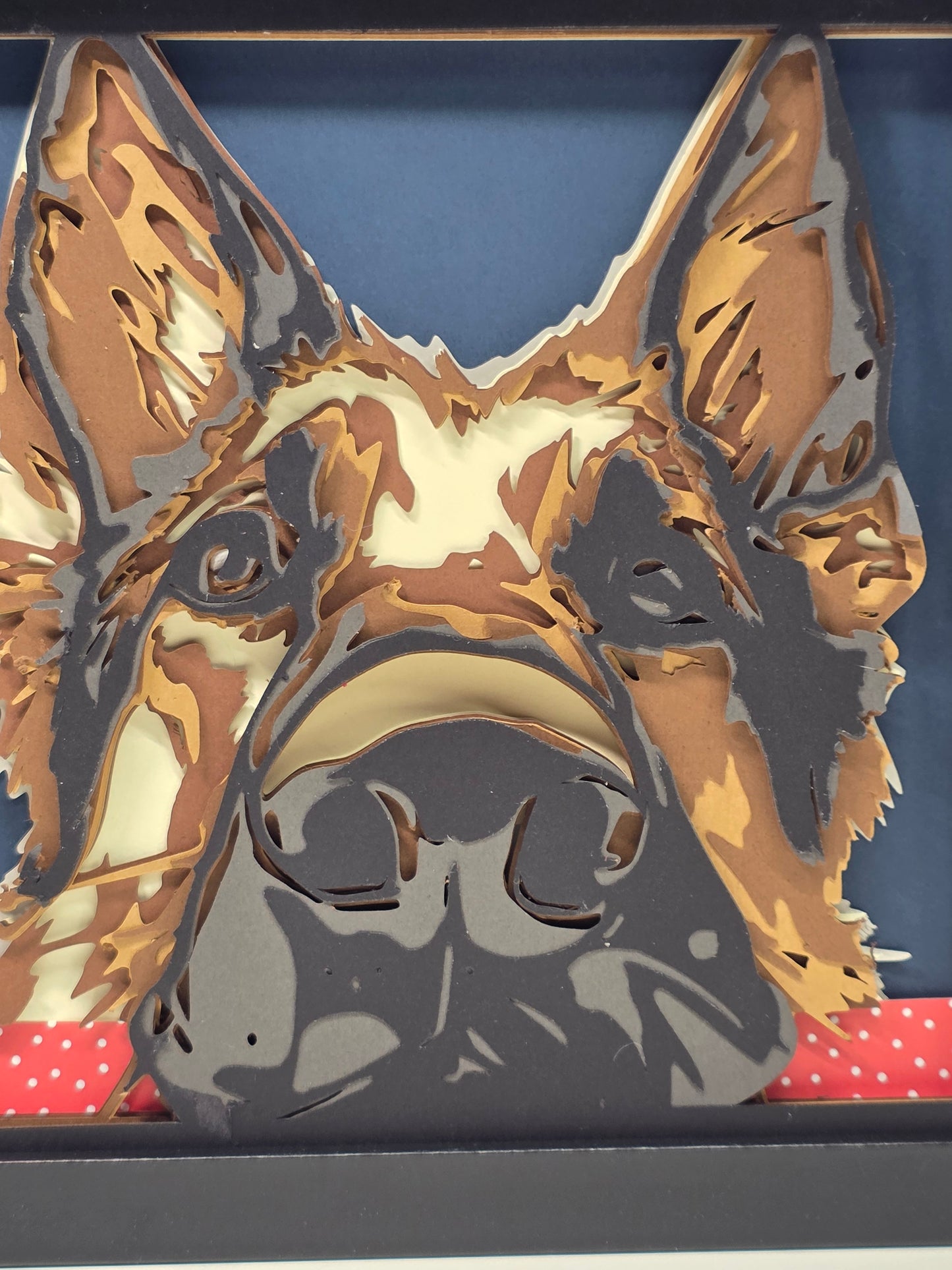 German Shepherd with head on table.