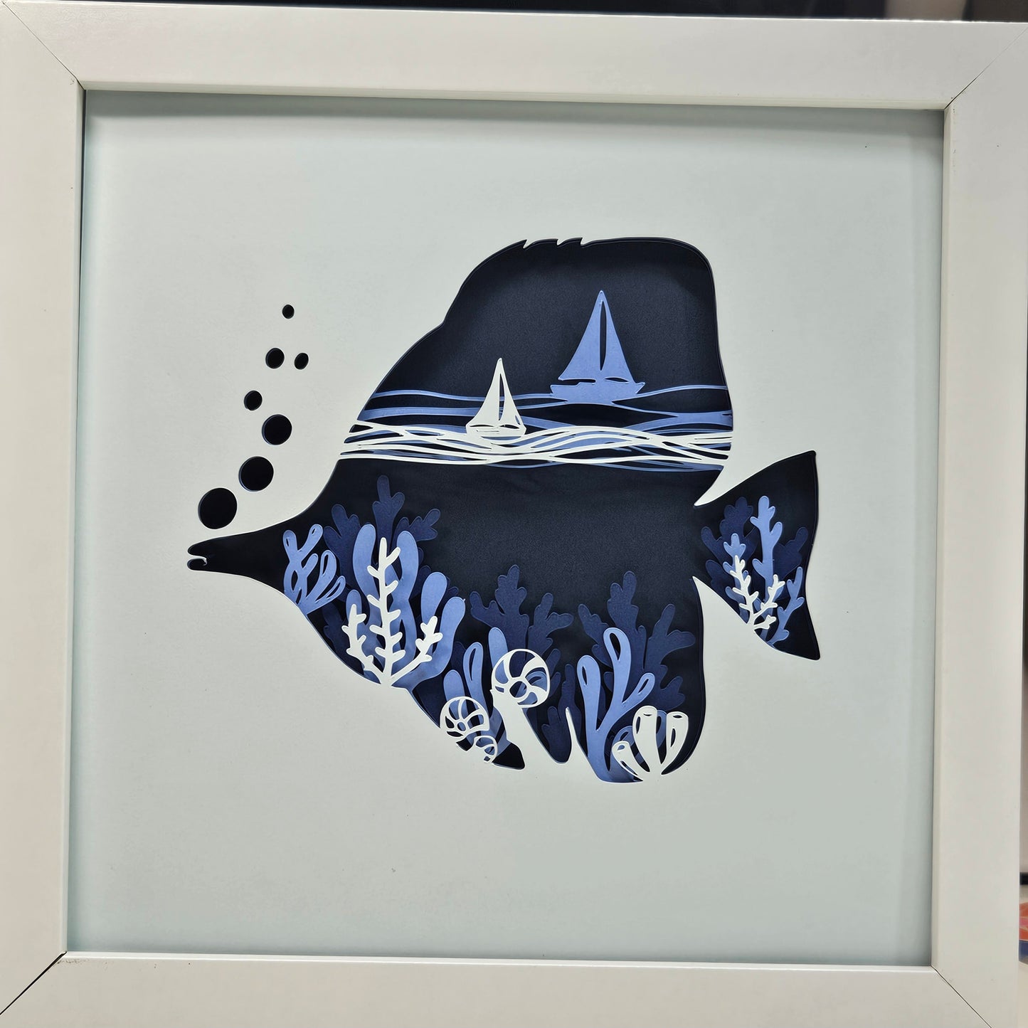 Tang Fish with coral and sail boats